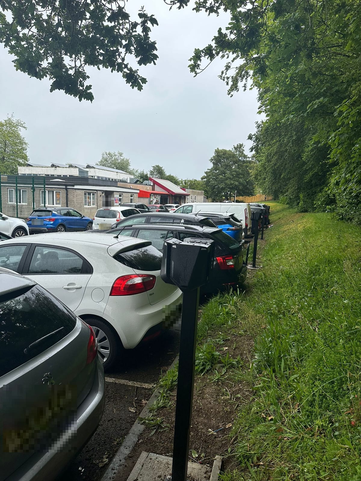 EV chargers along the edge of a school car park